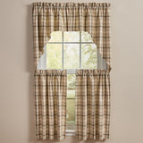 Toffee & Elm Plaid Swags beige green and brown plaid window curtains, including a top swags and two tier panels, styled on a window against a neutral beige wall.
