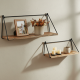 Square lifestyle image retaining the shelf orientation with a limewash wall, fall florals, family frame, and candles