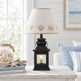 Cambridge black lantern lamp with Sea Shell shade in coastal cottage setting