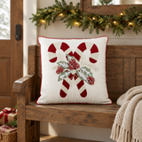 Candy Cane & Holly Pillow on a Christmas-themed wooden bench