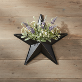 Faceted metal star wall hanging with compact lavender and sage floral mix