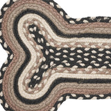 Close-up of Farmstead Charcoal Dog Bone Braided Rug Mat showing tightly woven recycled polyester braids in bleached white, asphalt, and grey taupe