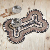 Farmstead Charcoal Dog Bone Braided Rug Mat styled on light wood floor with two stainless steel dog bowls and scattered dog treats