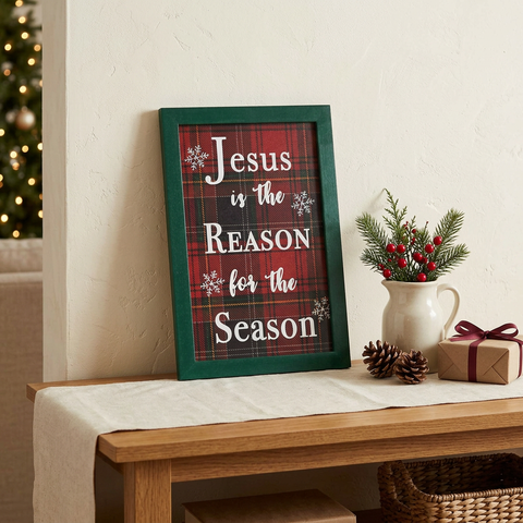 Jesus Is The Reason Plaid Framed Sign on a Christmas console table