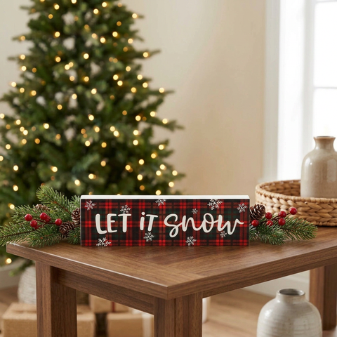 Revised horizontal Let It Snow sign in a Christmas setting
