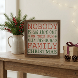 Nobody Is Walking Out On Christmas Sign in a cozy console-table setting