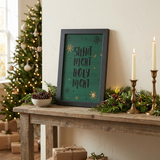 Silent Night Holy Night sign resting on a console table in a Christmas setting