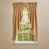 Simmons plaid prairie curtains set of 2 in tan, light brown, and barn red with scalloped hem hanging on farmhouse window
