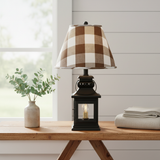 Black lantern lamp with Buffalo Brown Check shade in a farmhouse setting