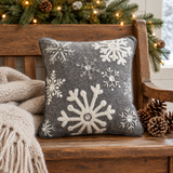 Snowflakes pillow on a Christmas-themed wooden bench